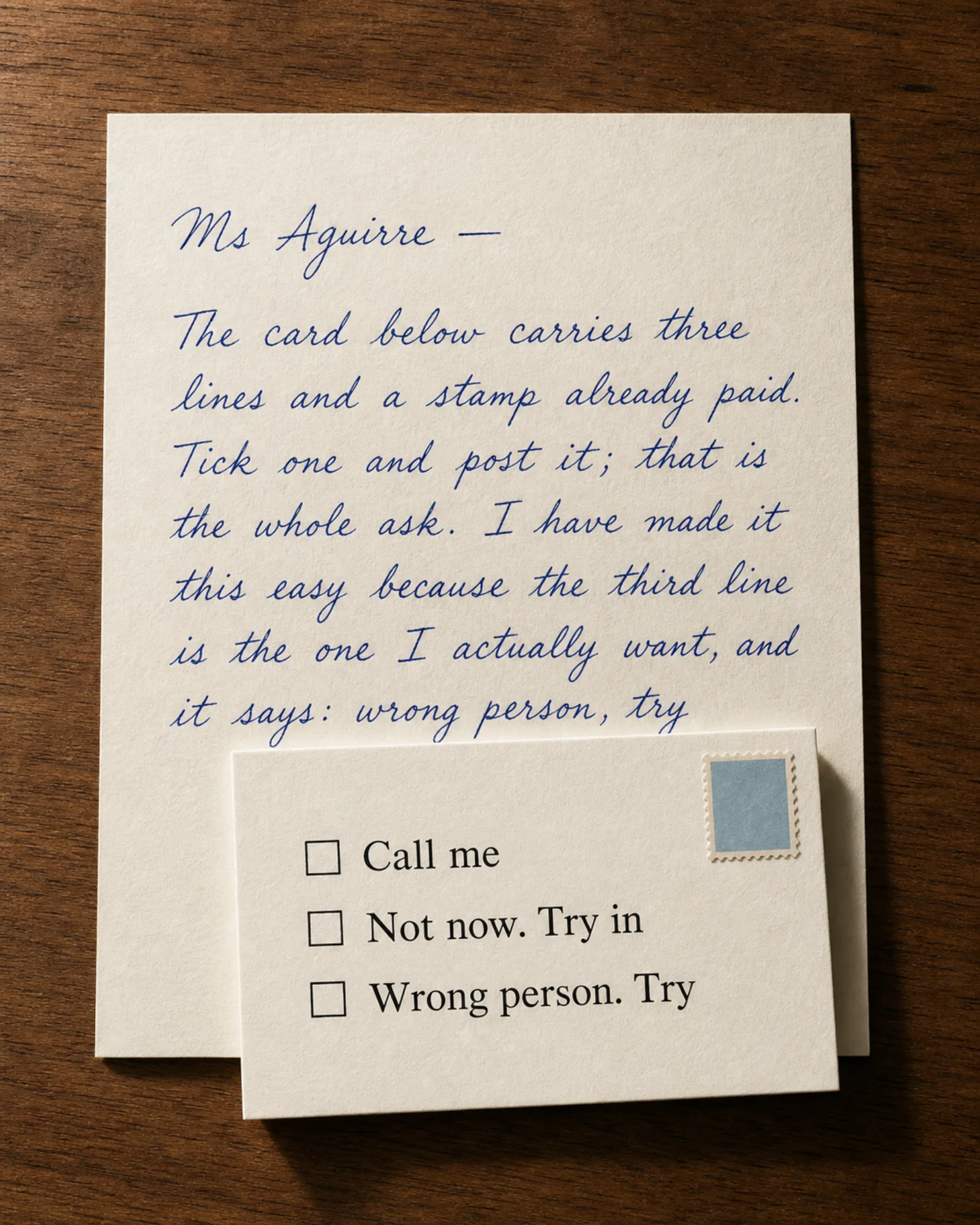 A prepaid reply card lying on a handwritten letter.